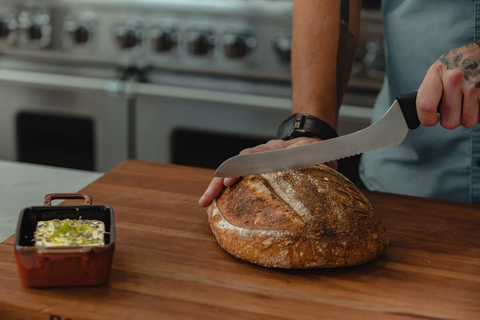 NDF sourdough being sliced for sharing